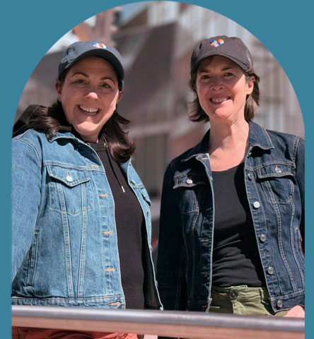 Image of the founders wearing hats outdoors